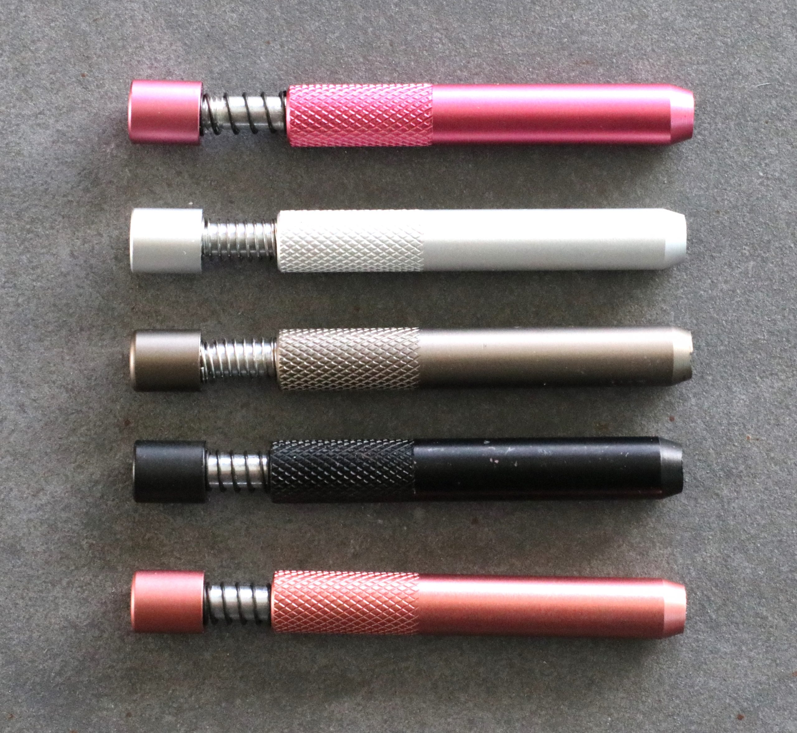 thumbnail interactive-video image 1 of Self-Cleaning Metal One Hitter – 5 Pack Black Spring-Loaded Dugout Pipe 1 of 5