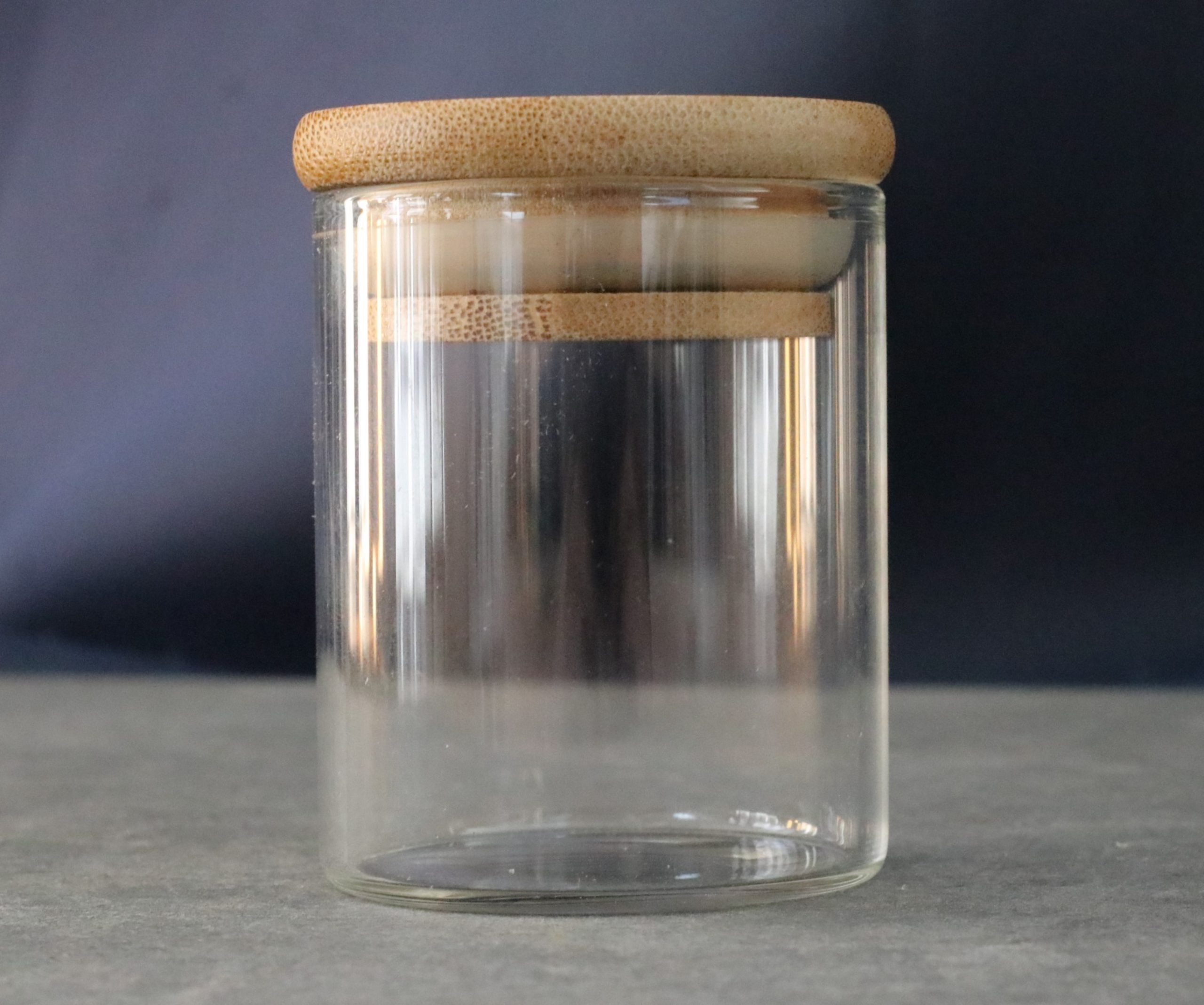 Small glass storage jar with bamboo lid