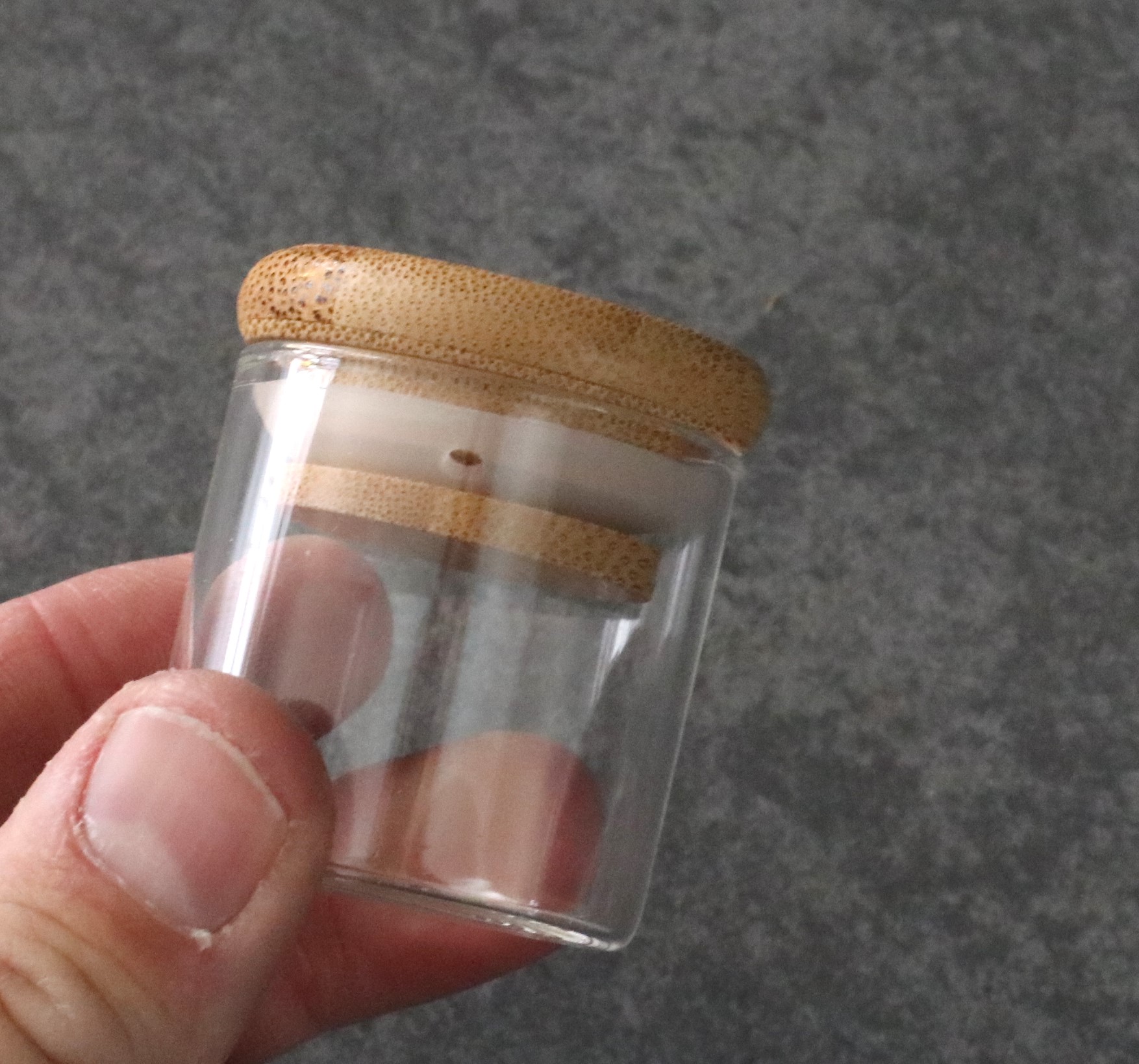 Small glass storage jar with bamboo lid